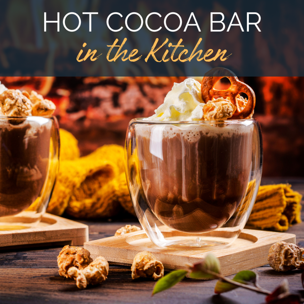 Image of a mug of hot chocolate with whipped cream and pretzels on top. Text reads: Hot Cocoa Bar in the Kitchen