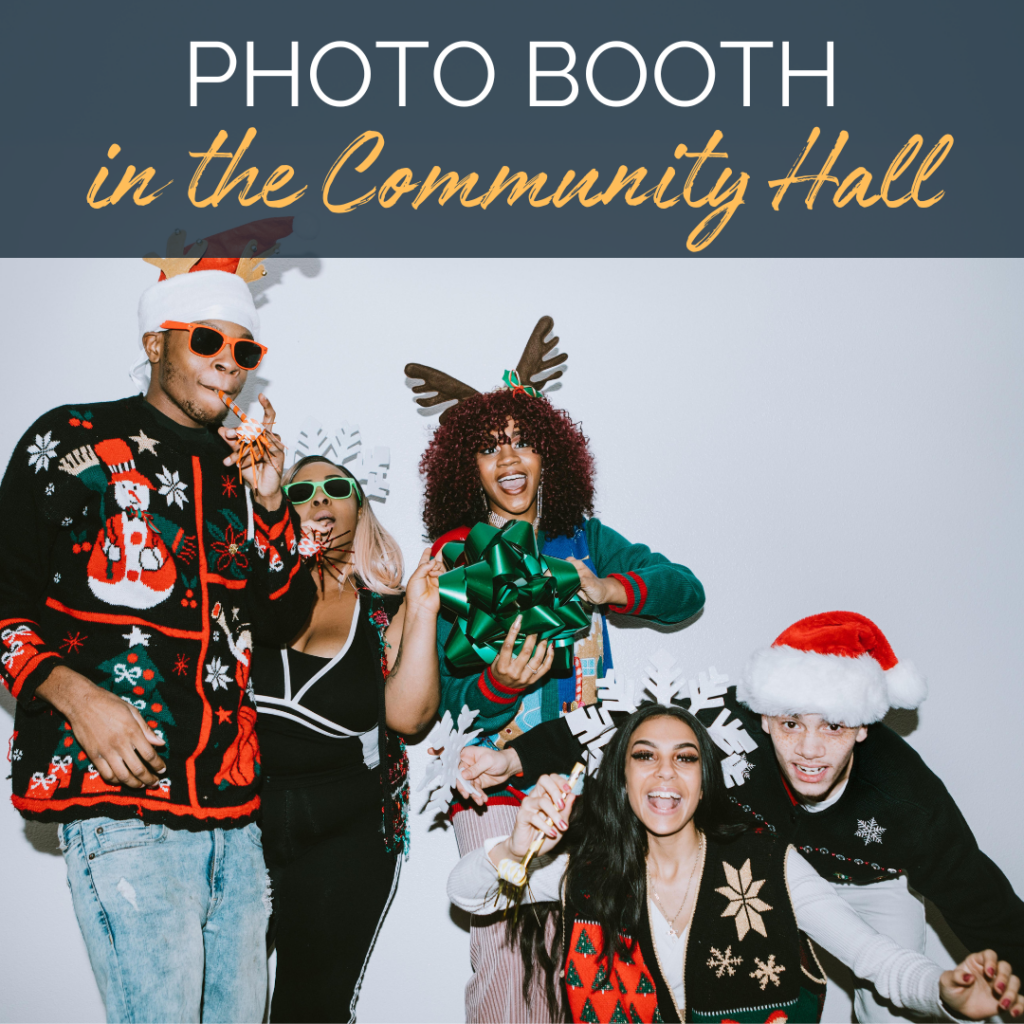 Image of a group a people in holiday outfits in a photo booth. Text reads: Photo booth in the Community Hall