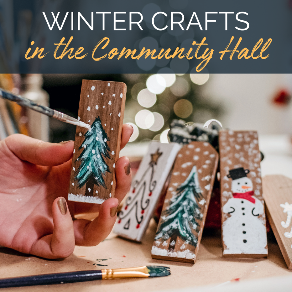 Image of a hand painting a Christmas tree on a tiny wood canvas. Text reads: Winter crafts in the Community Hall